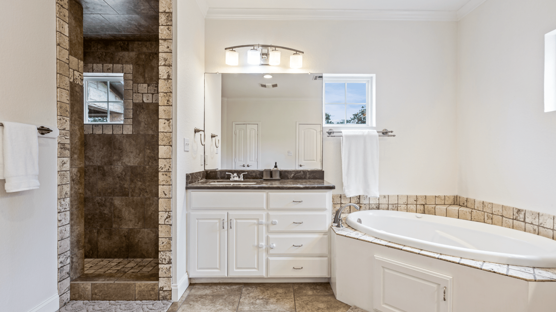 a room with a sink and a mirror